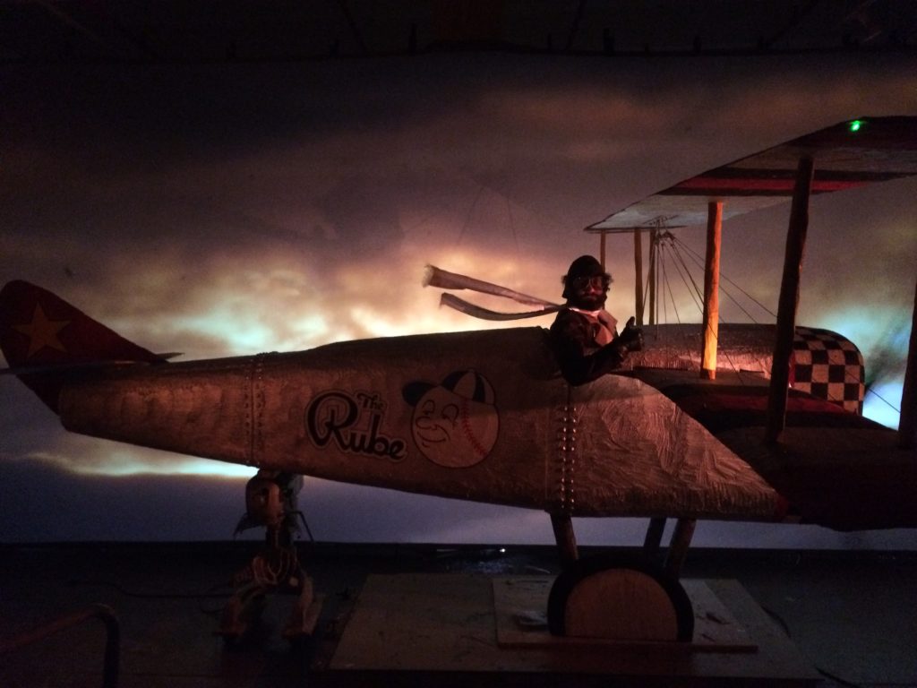 Production still of Jonathan Campolo flying a bi-plane in 